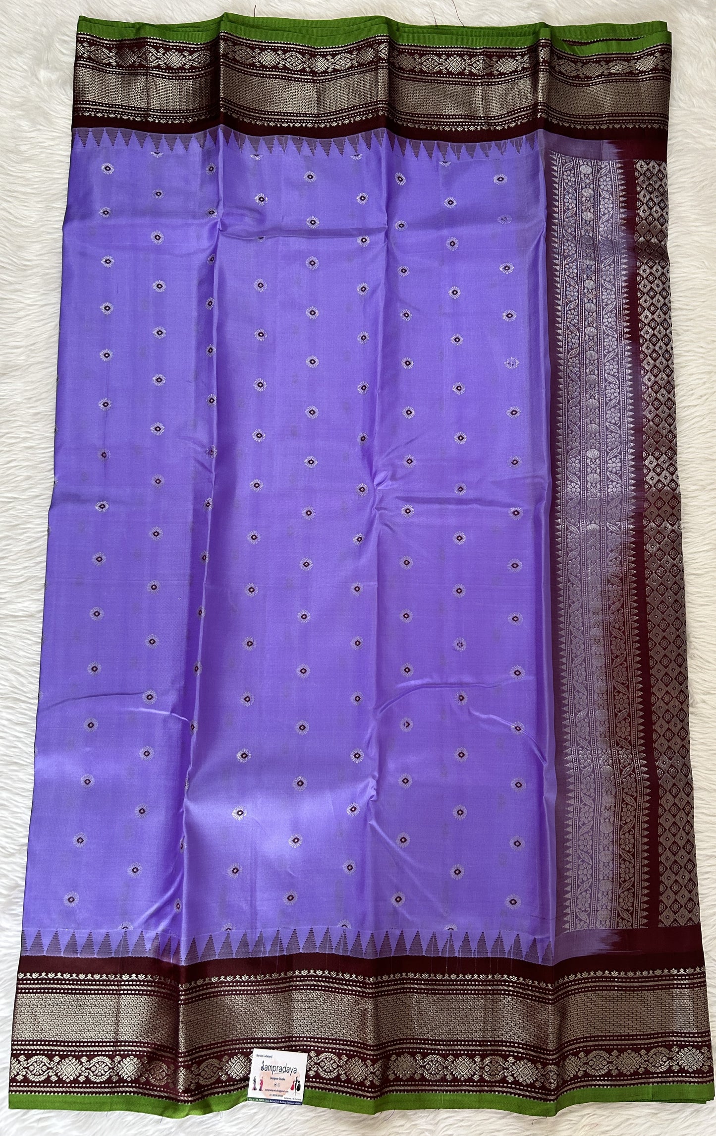 Gadwal Pattu Saree Lavender colored saree complemented with a Brown Kanchi Border - Sampradaya Designer Studio
