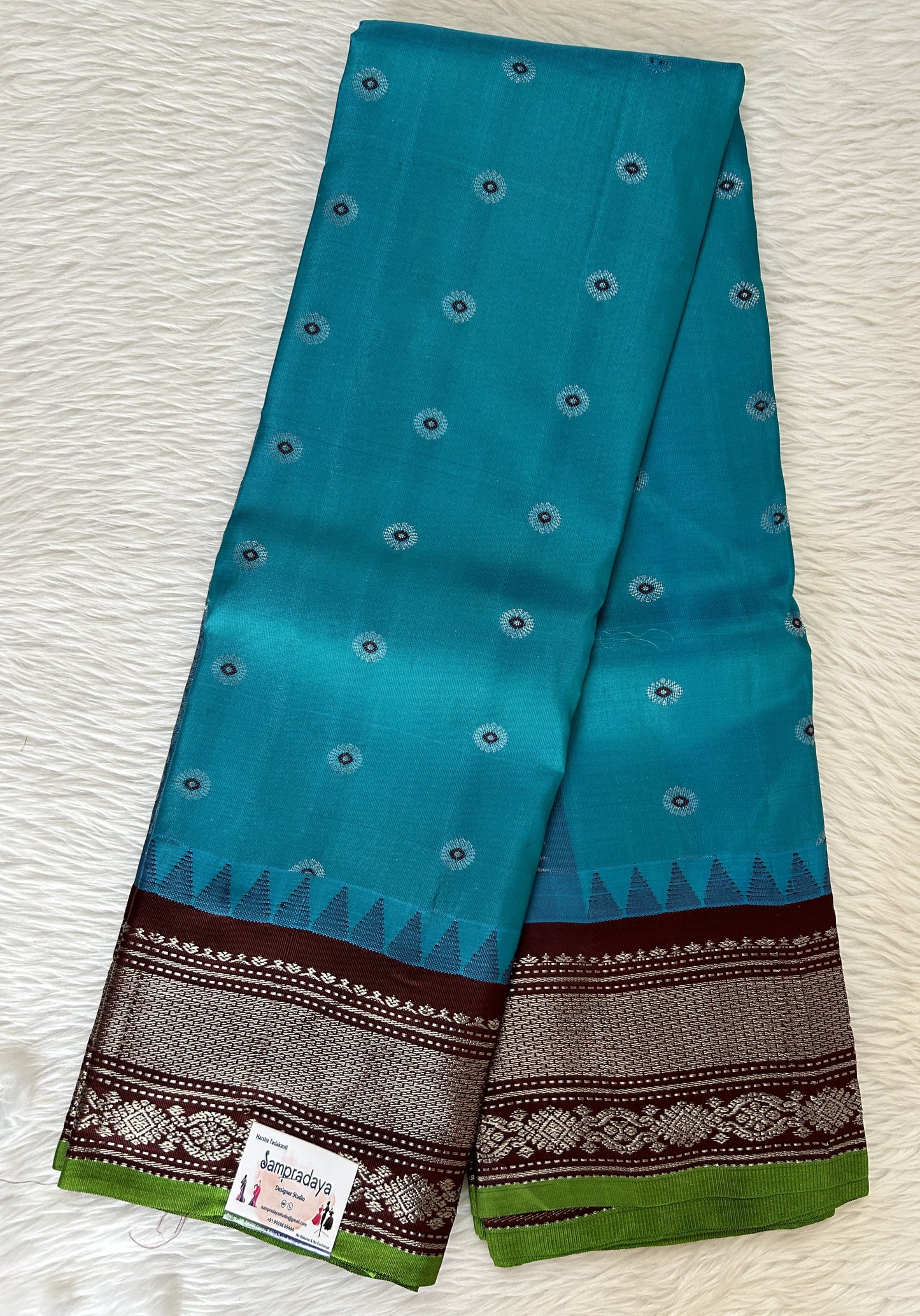 Gadwal Pattu Saree Turquoise Blue colored saree complemented with a Brown Kanchi Border - Sampradaya Designer Studio