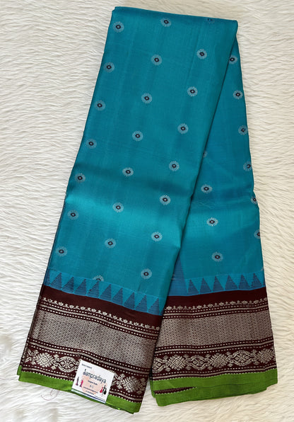 Gadwal Pattu Saree Turquoise Blue colored saree complemented with a Brown Kanchi Border - Sampradaya Designer Studio