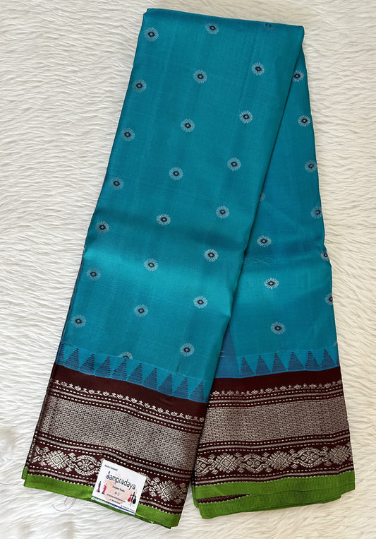 Gadwal Pattu Saree Turquoise Blue colored saree complemented with a Brown Kanchi Border - Sampradaya Designer Studio