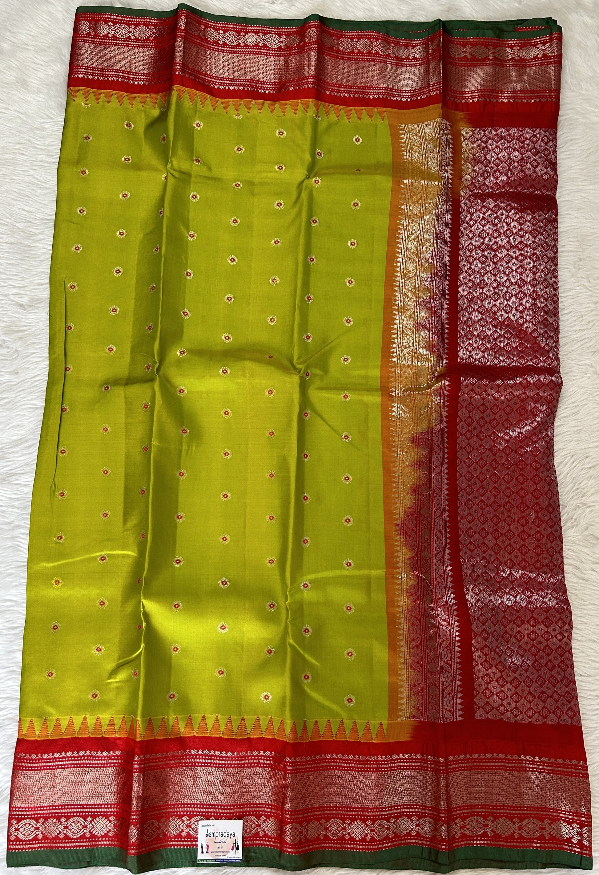 Gadwal Pattu Saree Acid Green colored saree complemented with a Candy Red Kanchi Border - Sampradaya Designer Studio