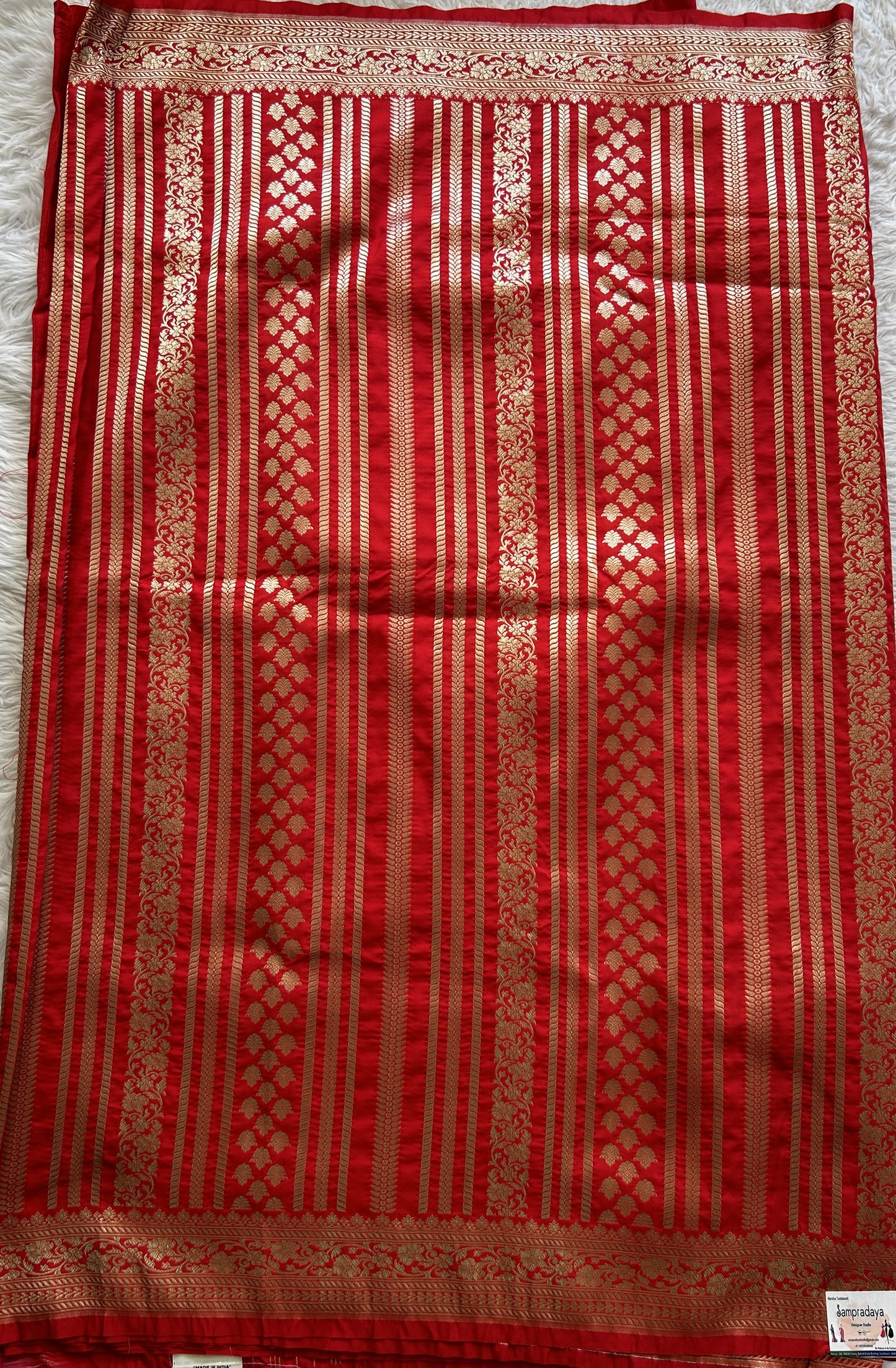 Banarasi Semi Katan Saree Red Colored Complemented with a Zari Border. - Sampradaya Designer Studio