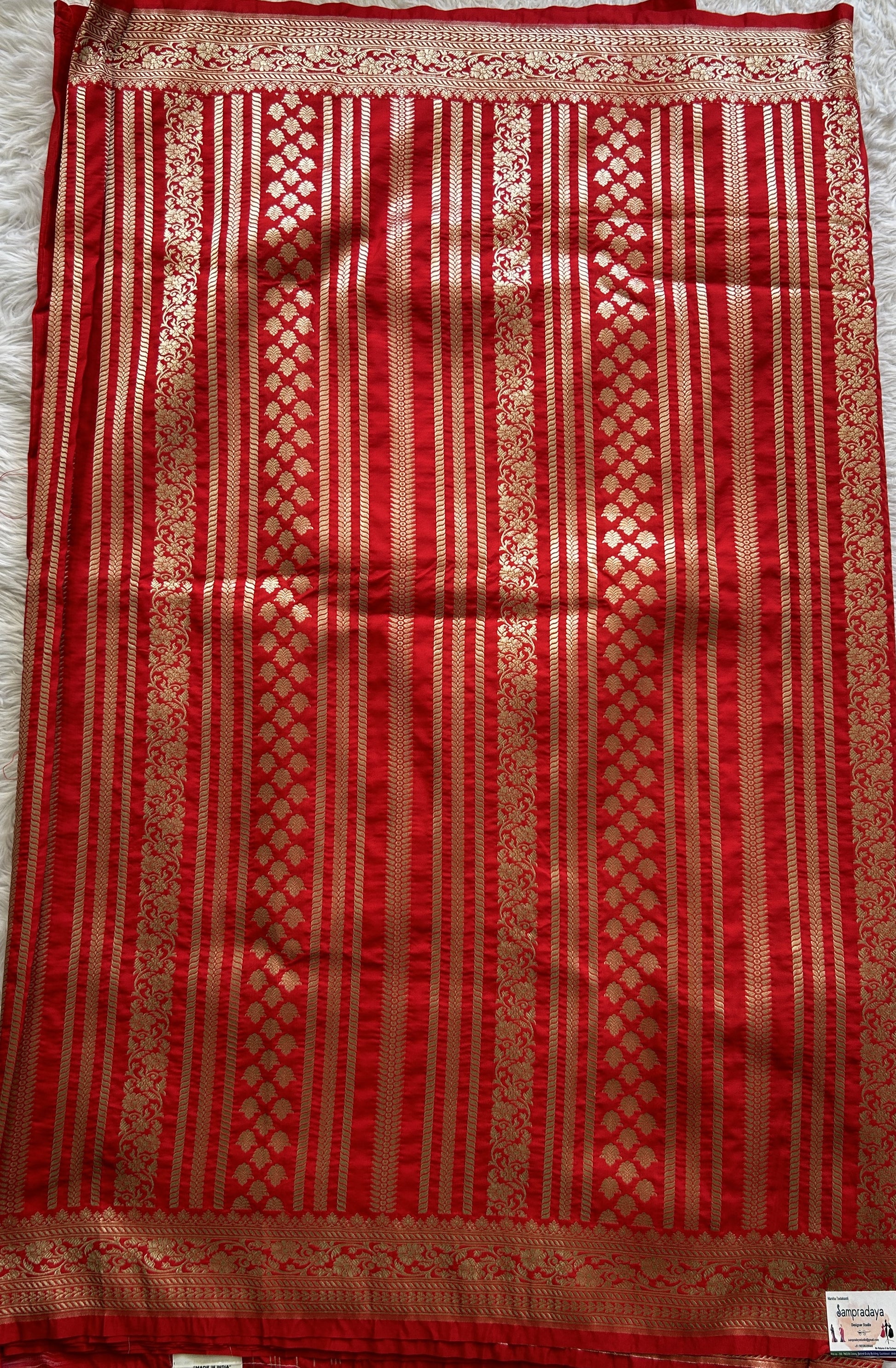 Banarasi Semi Katan Saree Red Colored Complemented with a Zari Border. - Sampradaya Designer Studio