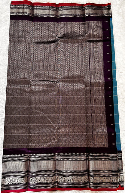 Gadwal Pattu Saree Aqua Blue colored saree complemented with a Dark Violet Kanchi Border - Sampradaya Designer Studio