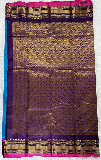 Gadwal Pattu Saree Turquoise Blue colored saree complemented with a Magenta Kanchi Border - Sampradaya Designer Studio