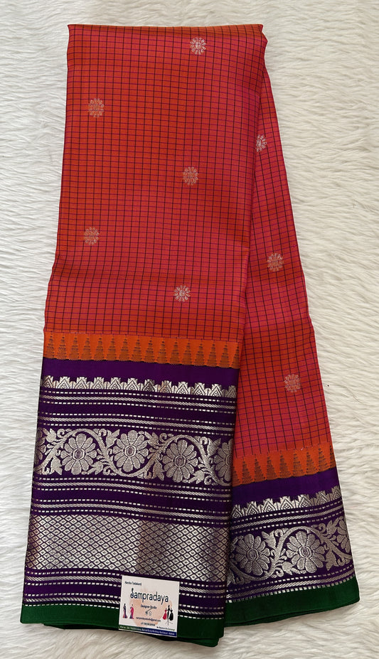 Gadwal Pattu Saree Peachy Pink colored saree complemented with a Purple Color Kanchi Border - Sampradaya Designer Studio