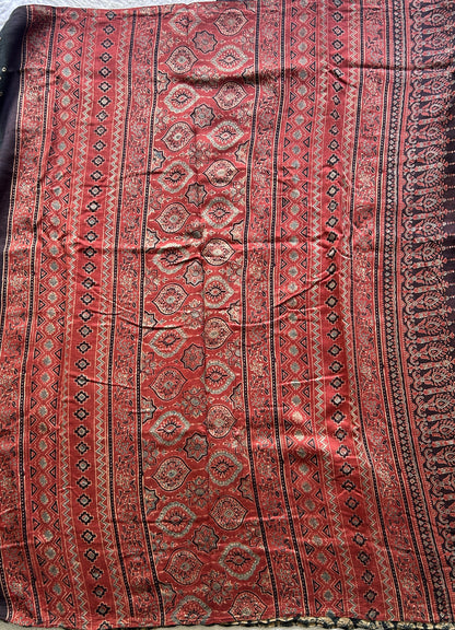 Bandhani Saree Black Colored Elegantly Paired with a Borderless. - Sampradaya Designer Studio