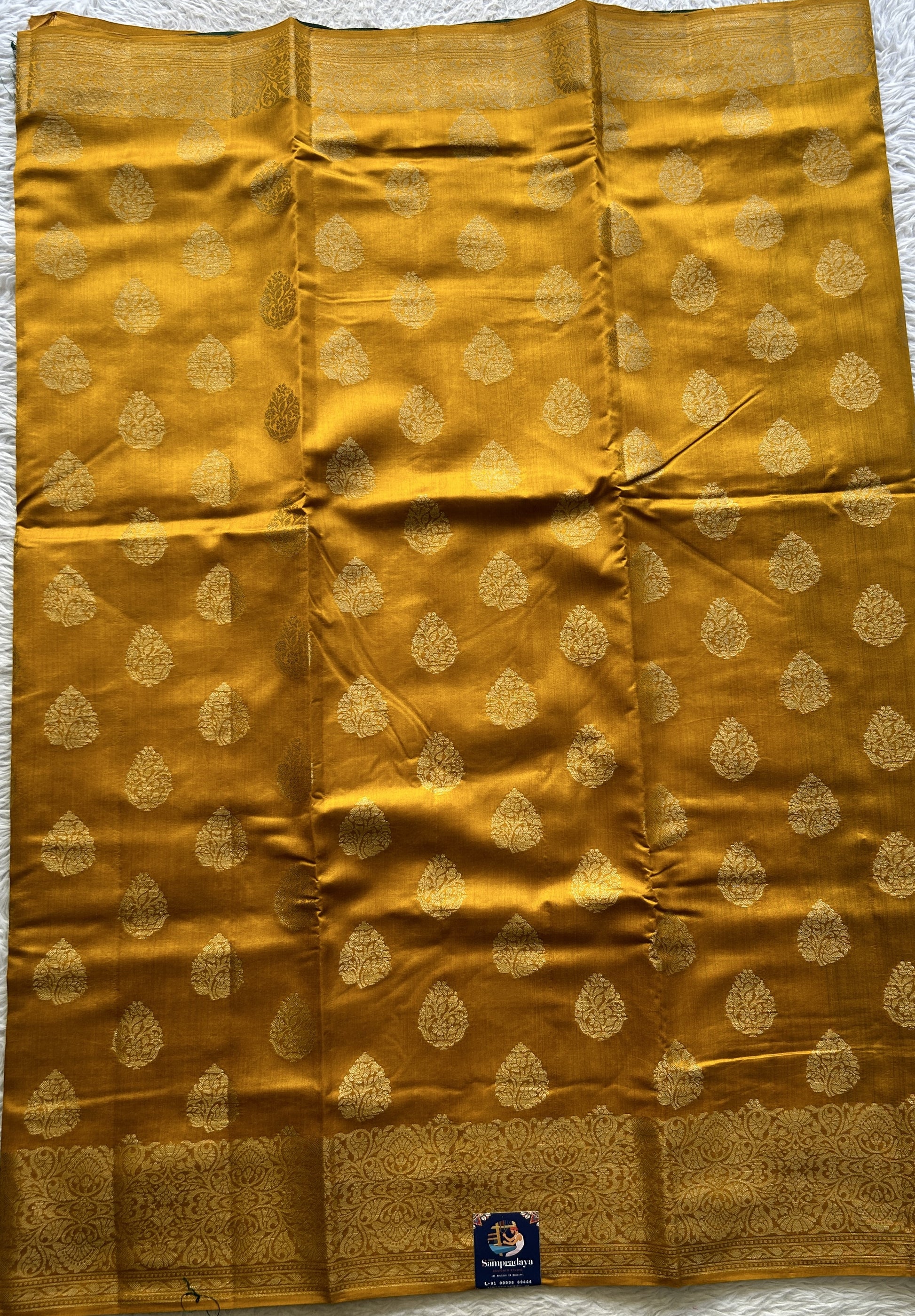 Chiniya Silk Saree Yellow Colored exquisite with a Zari Border. - Sampradaya Designer Studio