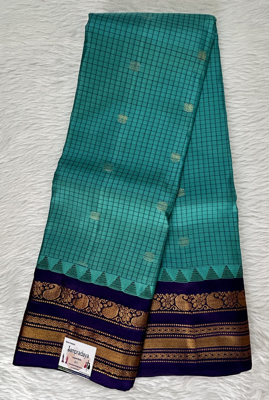 Gadwal Pattu Saree Sea Green colored saree complemented with a Indigo Blue Color Kanchi Border - Sampradaya Designer Studio