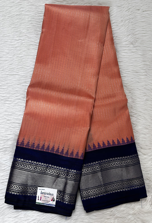 Gadwal Pattu Saree Peach colored saree complemented with a Indigo Blue Color Kanchi Border - Sampradaya Designer Studio