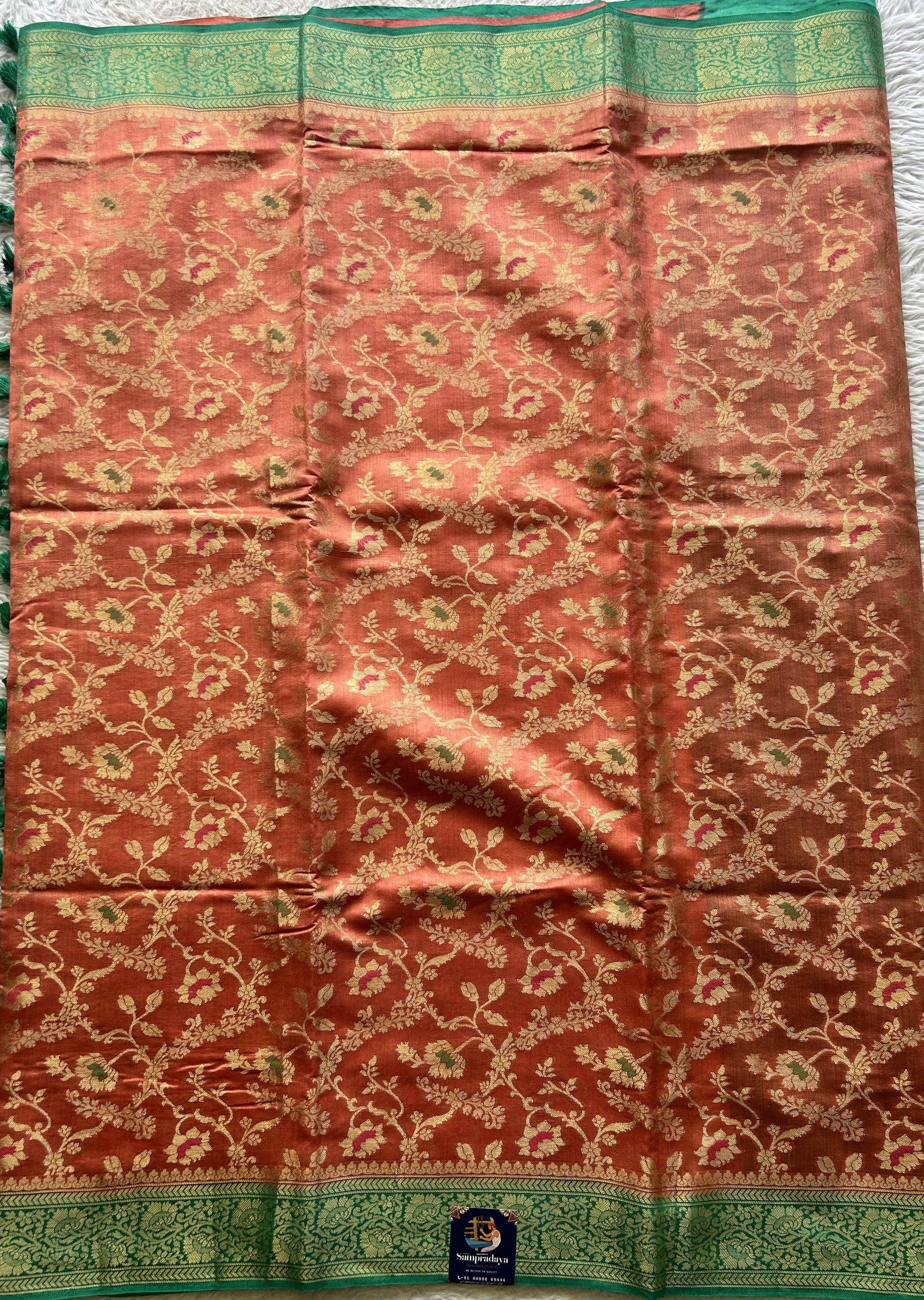 Chiniya Silk Saree Peach Colored Elegantly Paired with a Rama Green Color Zari Border. - Sampradaya Designer Studio