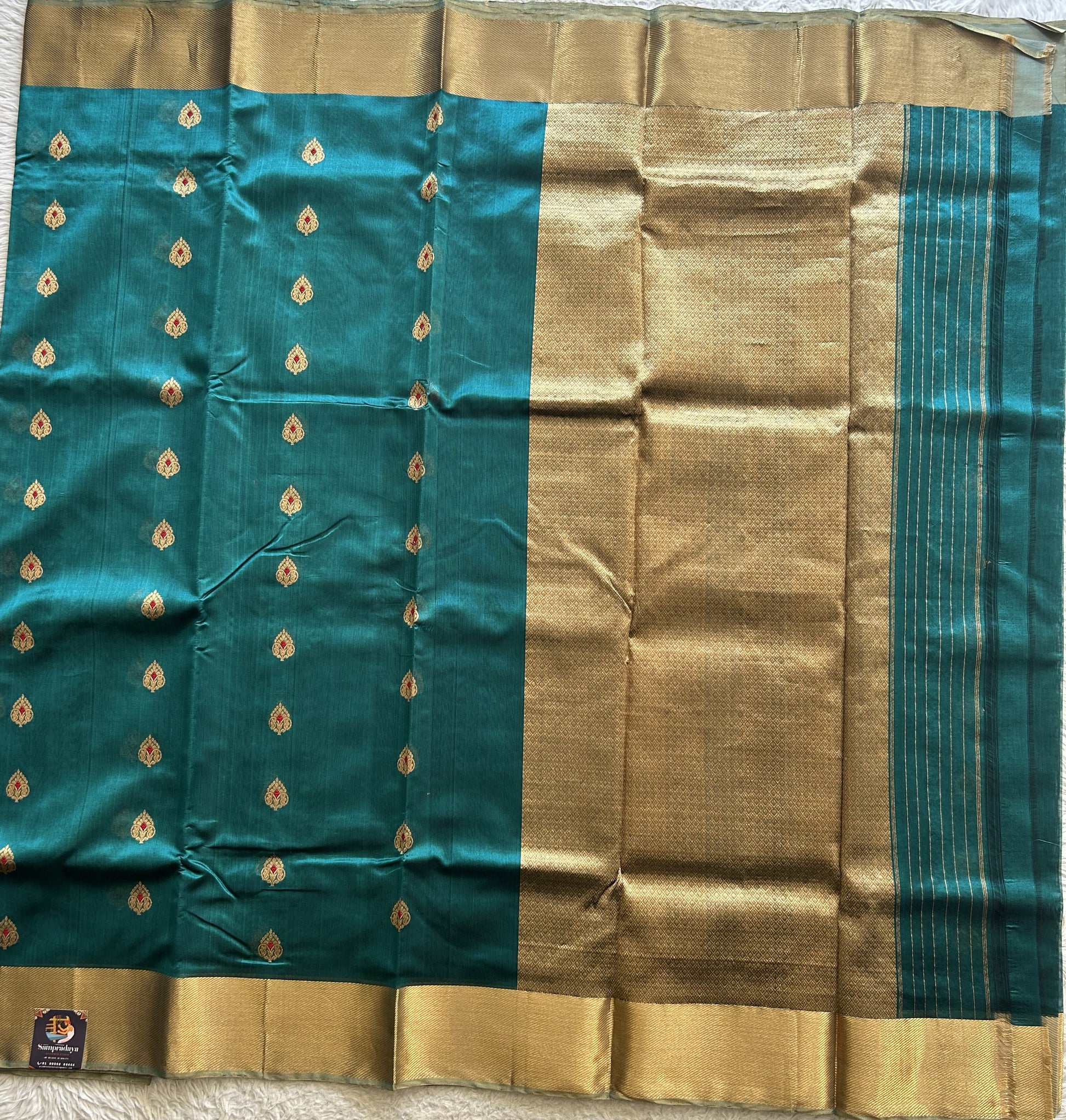 Chanderi Silk Rama Blue color Elegantly Paired with a Gold Zari border - Sampradaya Designer Studio