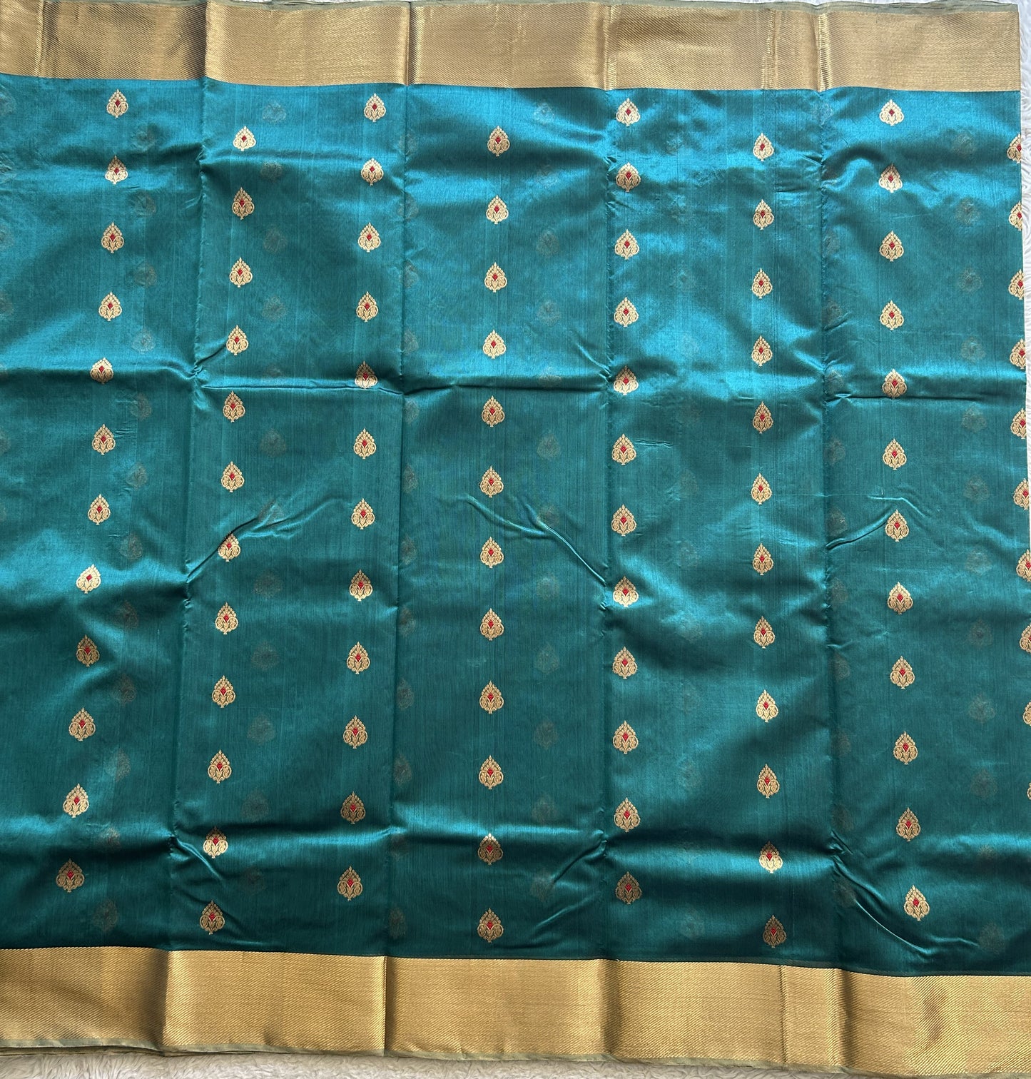Chanderi Silk Rama Blue color Elegantly Paired with a Gold Zari border - Sampradaya Designer Studio
