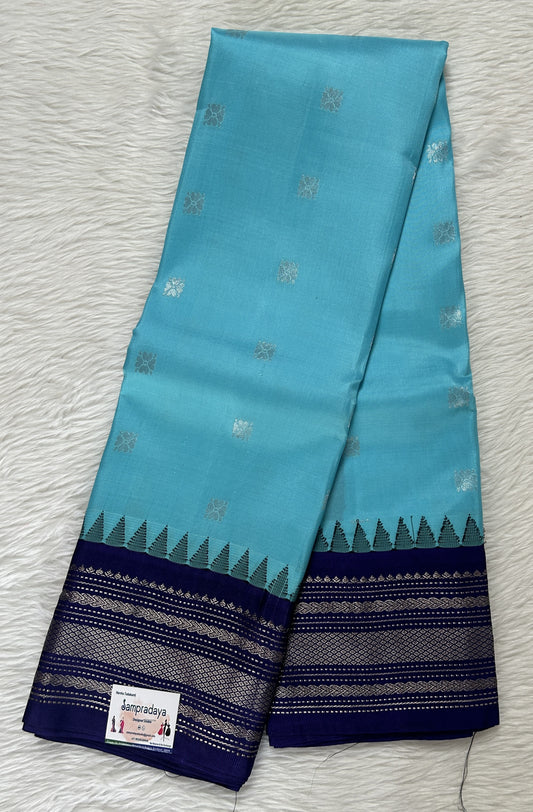 Gadwal Pattu Saree Fountain Blue colored saree complemented with a Indigo Blue Color Kanchi Border - Sampradaya Designer Studio