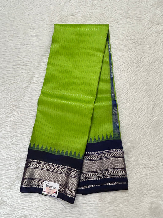 Gadwal Pattu Saree Parrot Green colored saree complemented with a Indigo Blue Color Kanchi Border - Sampradaya Designer Studio