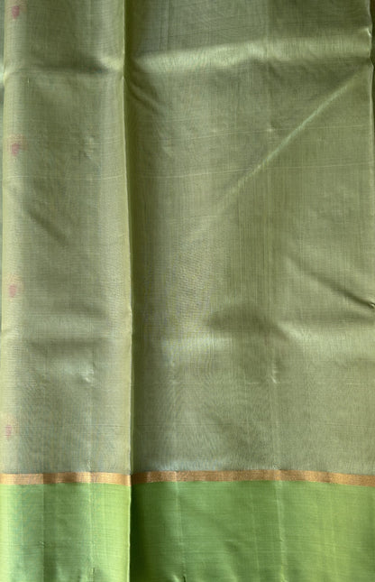 Chanderi Silk pasta Green color Elegantly Paired with a Gold Zari border - Sampradaya Designer Studio