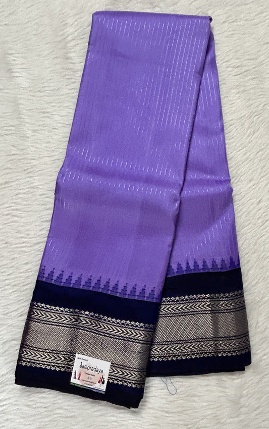 Gadwal Pattu Saree Lavender colored saree complemented with a Indigo Blue Color Kanchi Border - Sampradaya Designer Studio