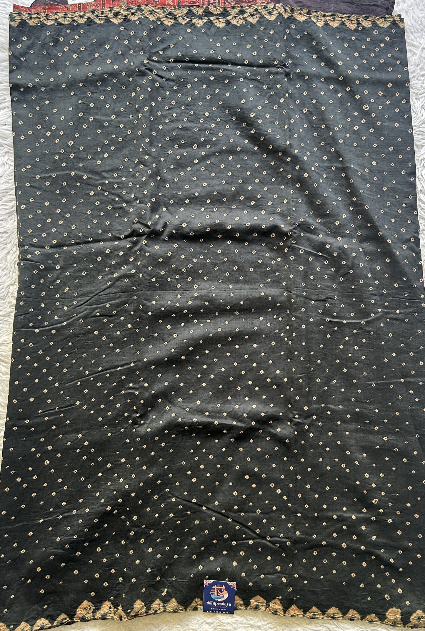 Bandhani Saree Black Colored Elegantly Paired with a Borderless. - Sampradaya Designer Studio