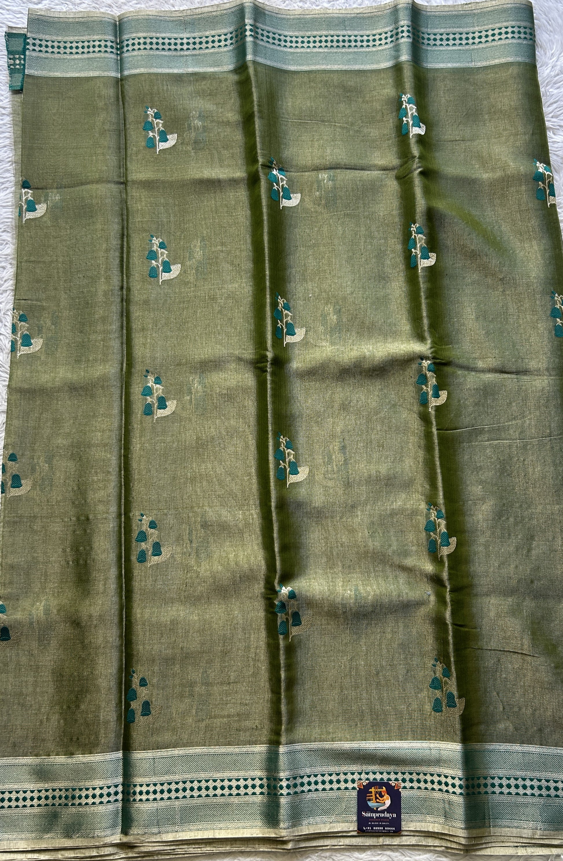 Chanderi Silk Saree Olive Green color Elegantly Paired with a Zari border - Sampradaya Designer Studio