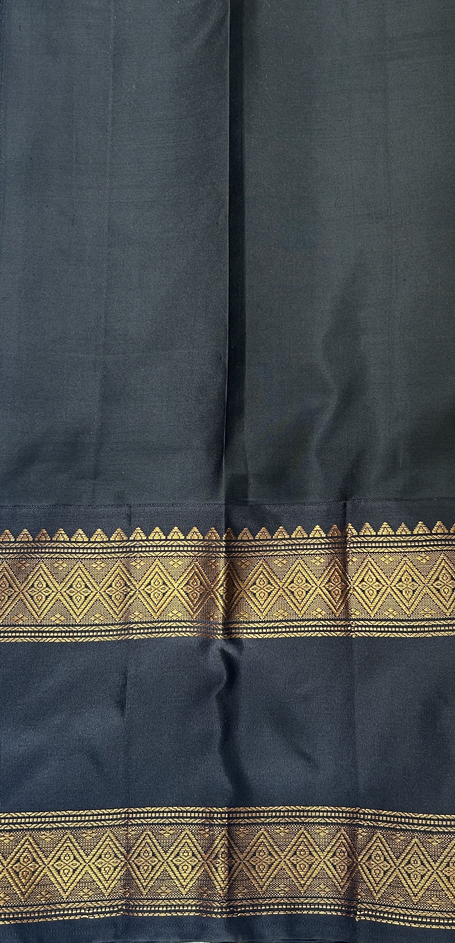 Gadwal Pattu Saree Mustard Yellow colored saree complemented with a Black Kanchi Gap Border - Sampradaya Designer Studio