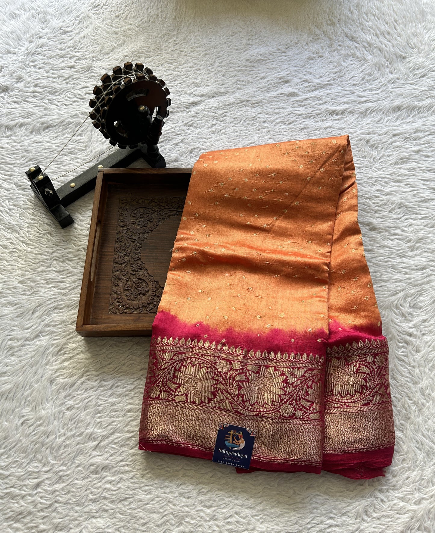 Bandhani Saree Orange Colored Elegantly Paired with a Dark Pink Color Zari Border. - Sampradaya Designer Studio