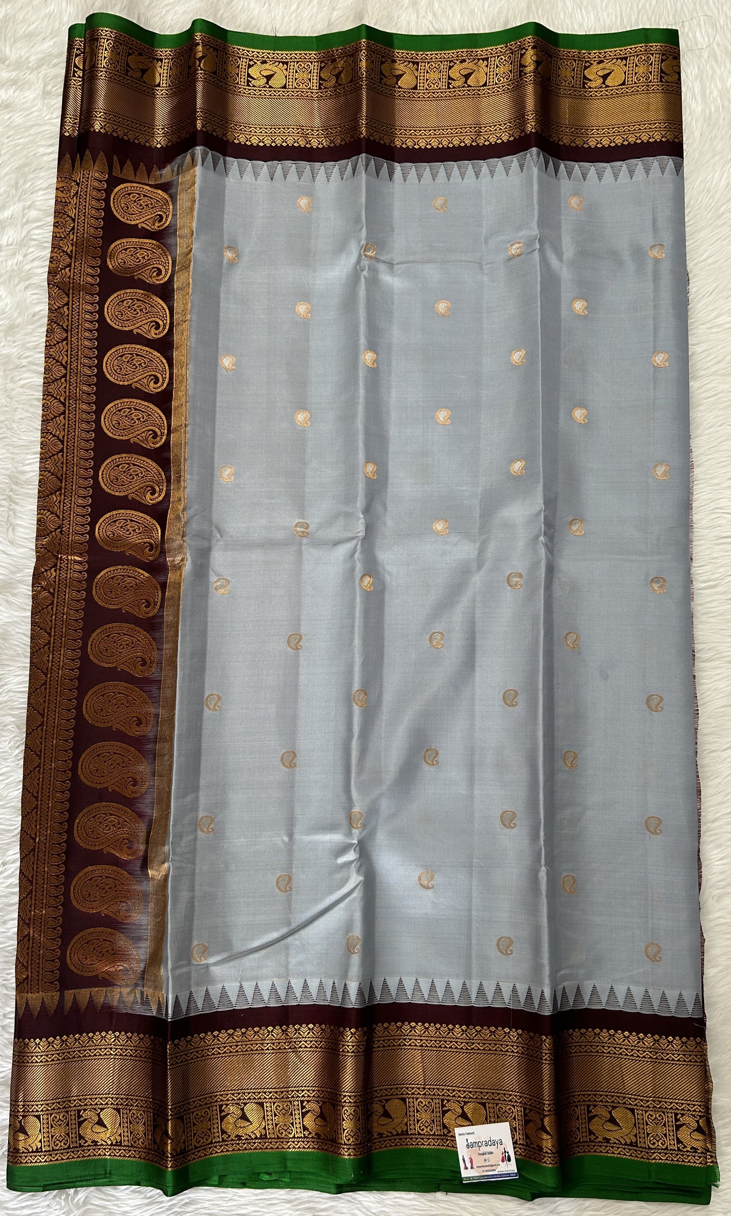 Gadwal Pattu Saree Light Gray colored saree complemented with a Brown Kanchi Border - Sampradaya Designer Studio