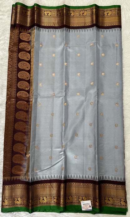 Gadwal Pattu Saree Light Gray colored saree complemented with a Brown Kanchi Border - Sampradaya Designer Studio