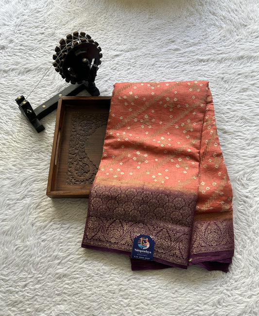 Bandhani Saree Peach Colored Elegantly Paired with a Purple color Zari Border. - Sampradaya Designer Studio