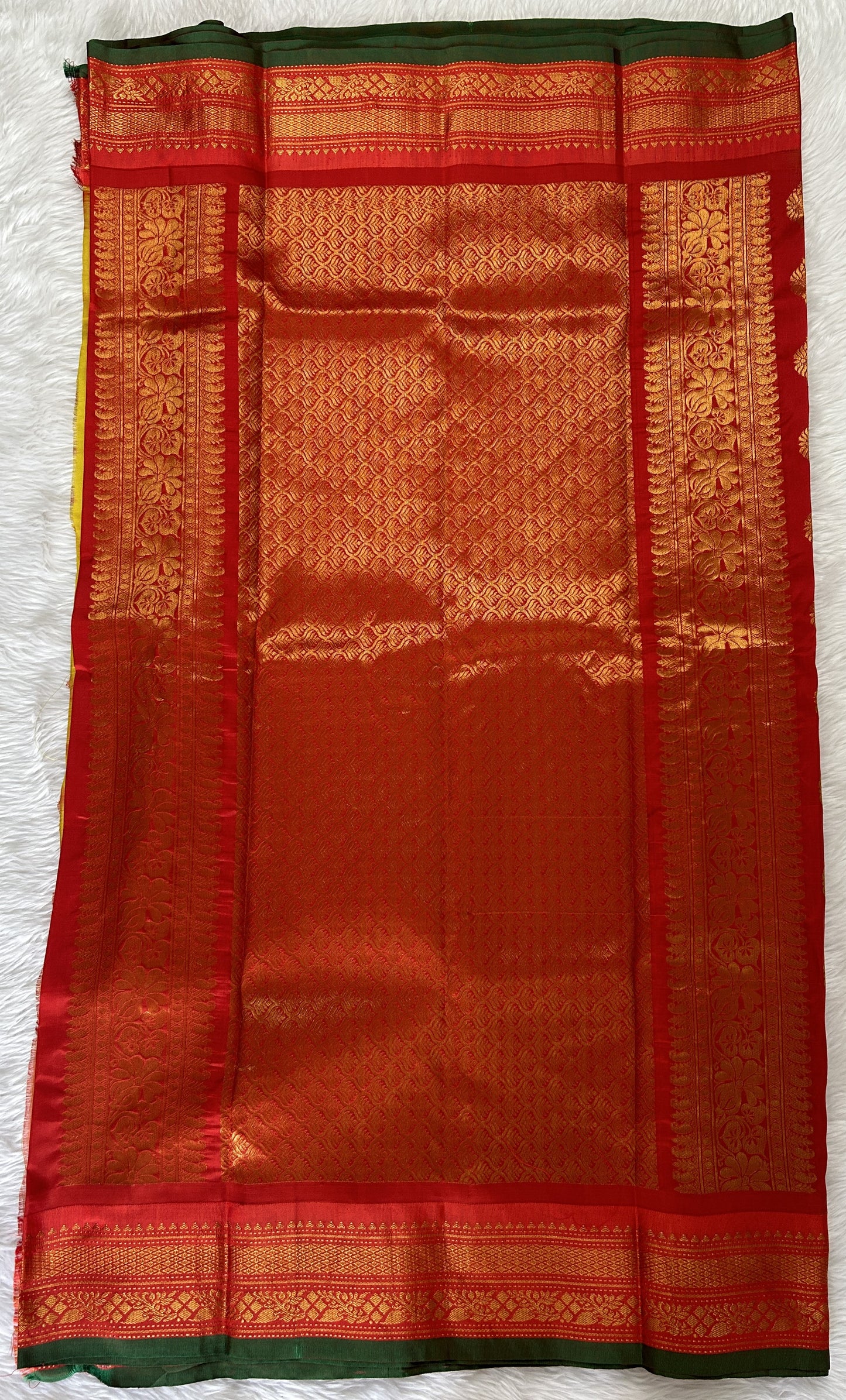 Gadwal Pattu Saree Yellow colored saree complemented with a Red Kanchi Border - Sampradaya Designer Studio