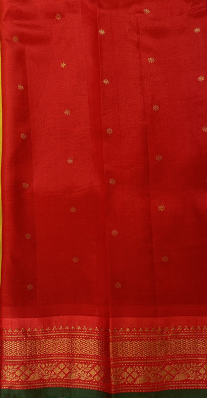 Gadwal Pattu Saree Yellow colored saree complemented with a Red Kanchi Border - Sampradaya Designer Studio