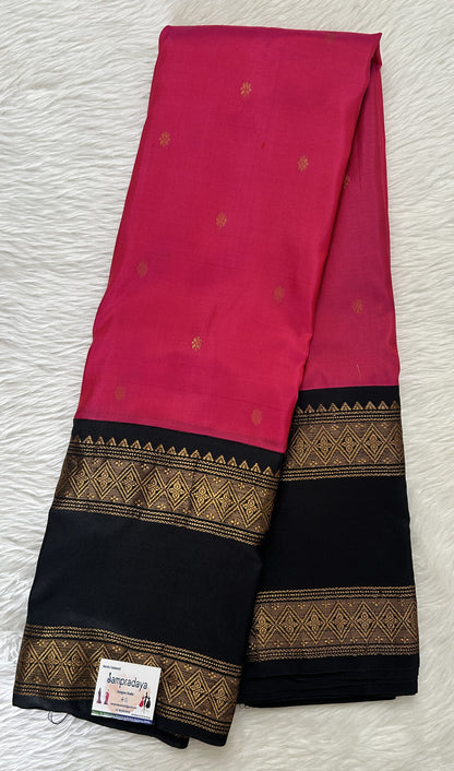 Gadwal Pattu Saree Pink colored saree complemented with a Black Kanchi Border - Sampradaya Designer Studio