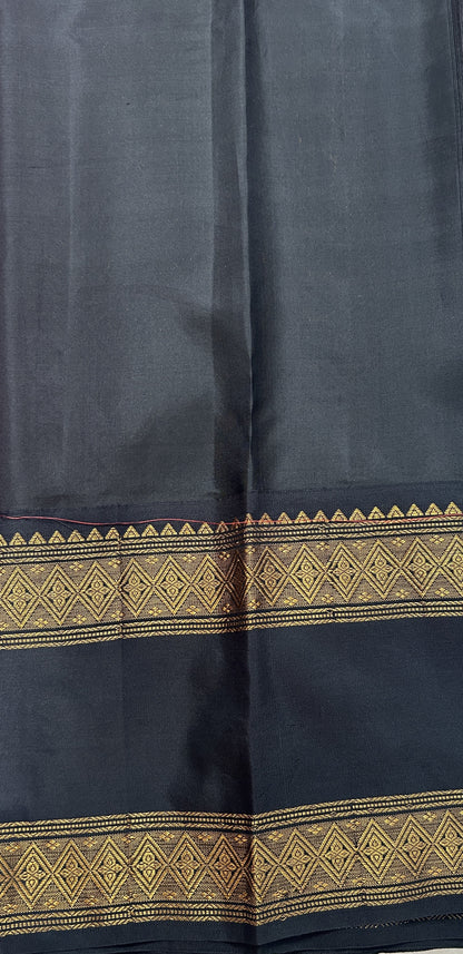 Gadwal Pattu Saree Pink colored saree complemented with a Black Kanchi Border - Sampradaya Designer Studio