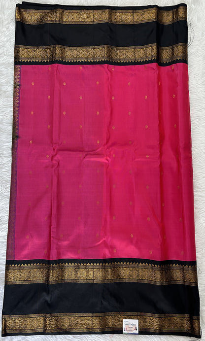 Gadwal Pattu Saree Pink colored saree complemented with a Black Kanchi Border - Sampradaya Designer Studio