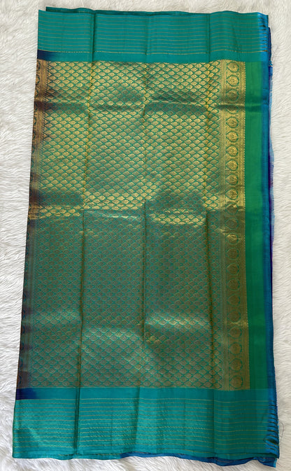 Gadwal Pattu Saree Purple colored saree complemented with a Turquoise Blue Checks Border - Sampradaya Designer Studio