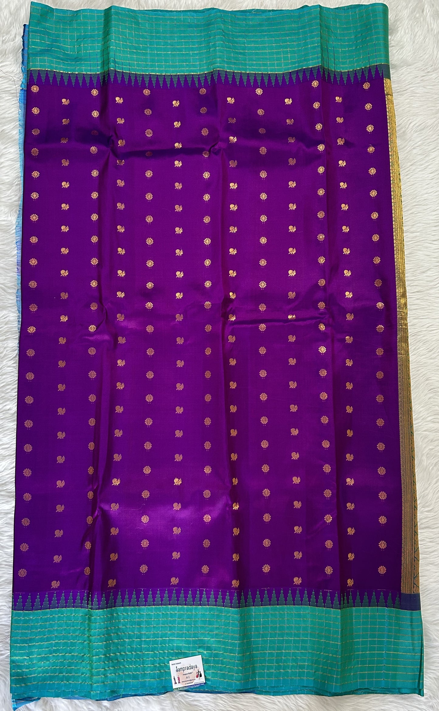 Gadwal Pattu Saree Purple colored saree complemented with a Turquoise Blue Checks Border - Sampradaya Designer Studio