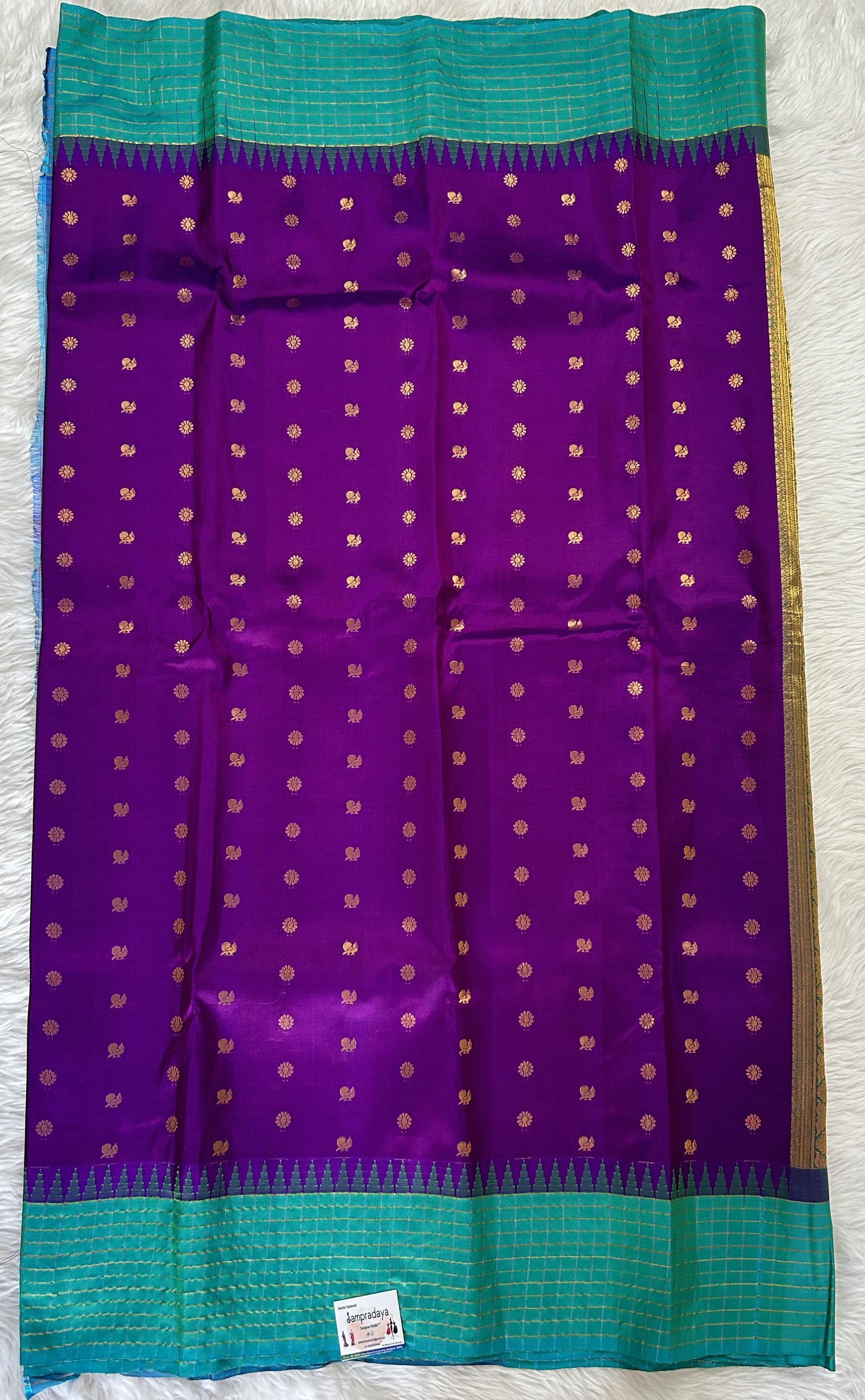 Gadwal Pattu Saree Purple colored saree complemented with a Turquoise Blue Checks Border - Sampradaya Designer Studio