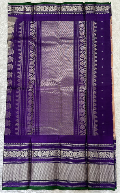 Gadwal Pattu Saree Light Peach colored saree complemented with a Violet Kanchi Border - Sampradaya Designer Studio