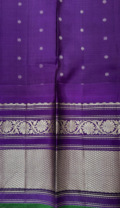 Gadwal Pattu Saree Light Peach colored saree complemented with a Violet Kanchi Border - Sampradaya Designer Studio