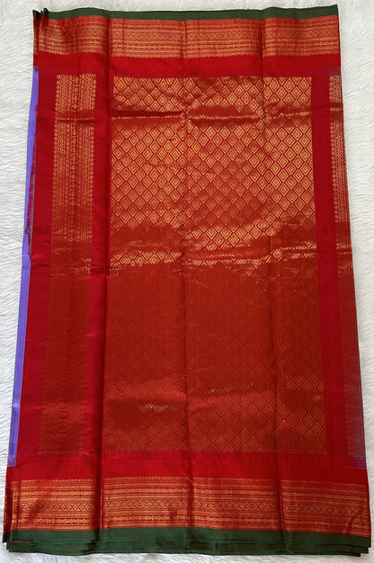 Gadwal Pattu Saree Lavender colored saree complemented with a Red Kanchi Border - Sampradaya Designer Studio