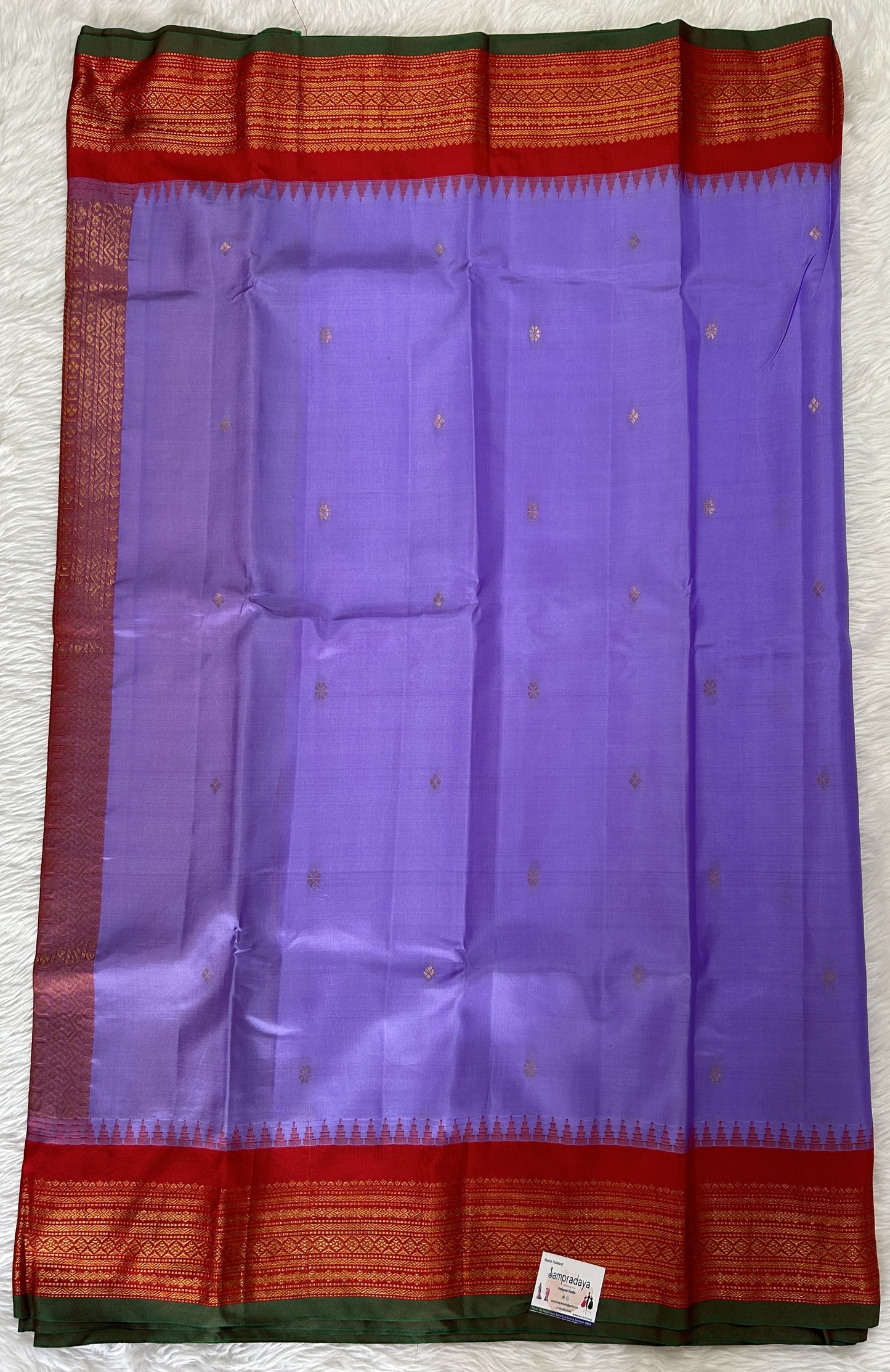 Gadwal Pattu Saree Lavender colored saree complemented with a Red Kanchi Border - Sampradaya Designer Studio