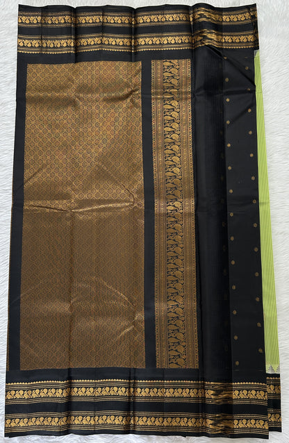 Gadwal Pattu Saree Pastel Green colored saree complemented with a Black Kanchi Gap Border - Sampradaya Designer Studio