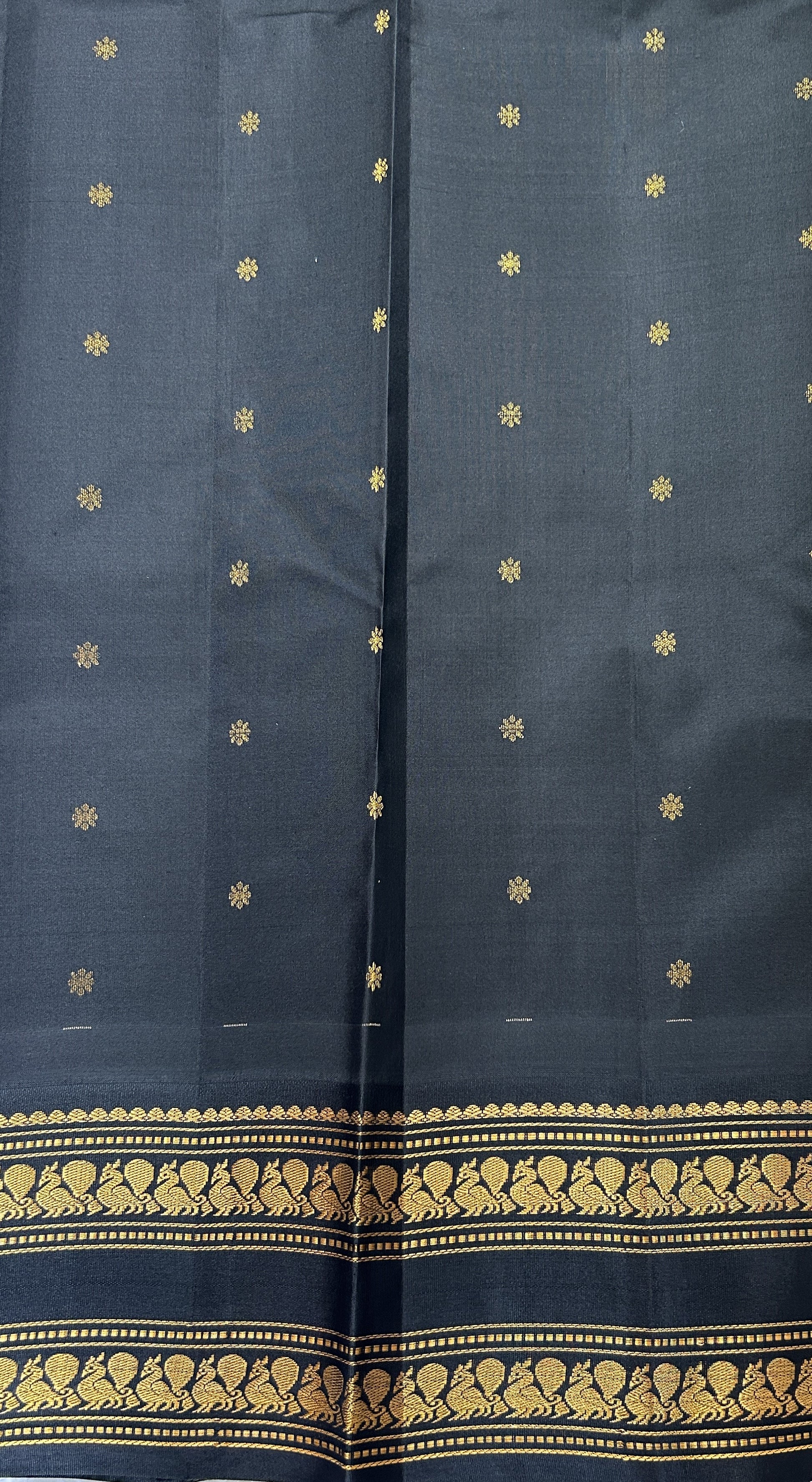 Gadwal Pattu Saree Pastel Green colored saree complemented with a Black Kanchi Gap Border - Sampradaya Designer Studio