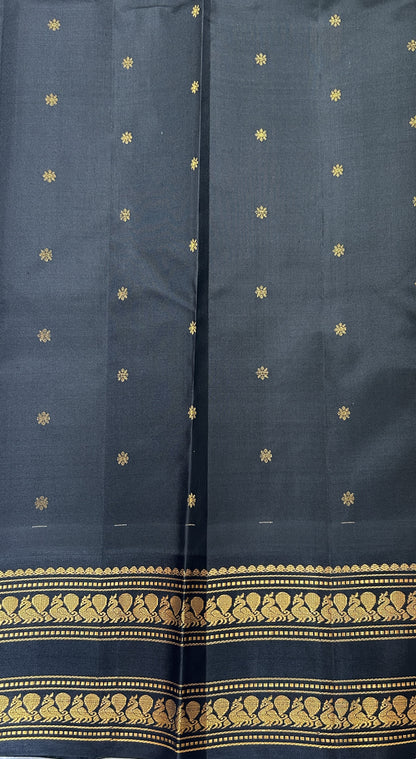 Gadwal Pattu Saree Pastel Green colored saree complemented with a Black Kanchi Gap Border - Sampradaya Designer Studio