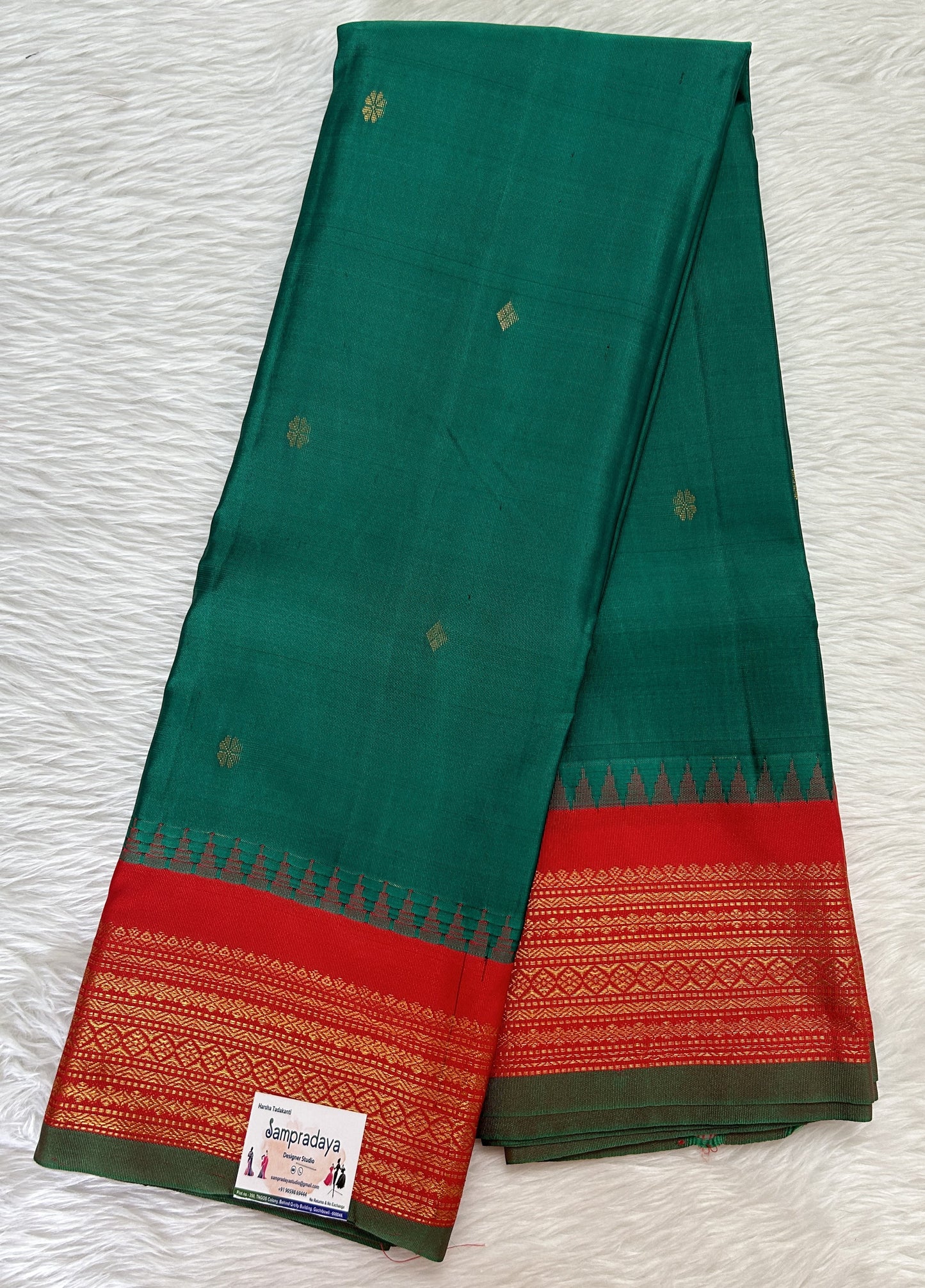 Gadwal Pattu Saree Dark Green colored saree complemented with a Red Kanchi Border - Sampradaya Designer Studio