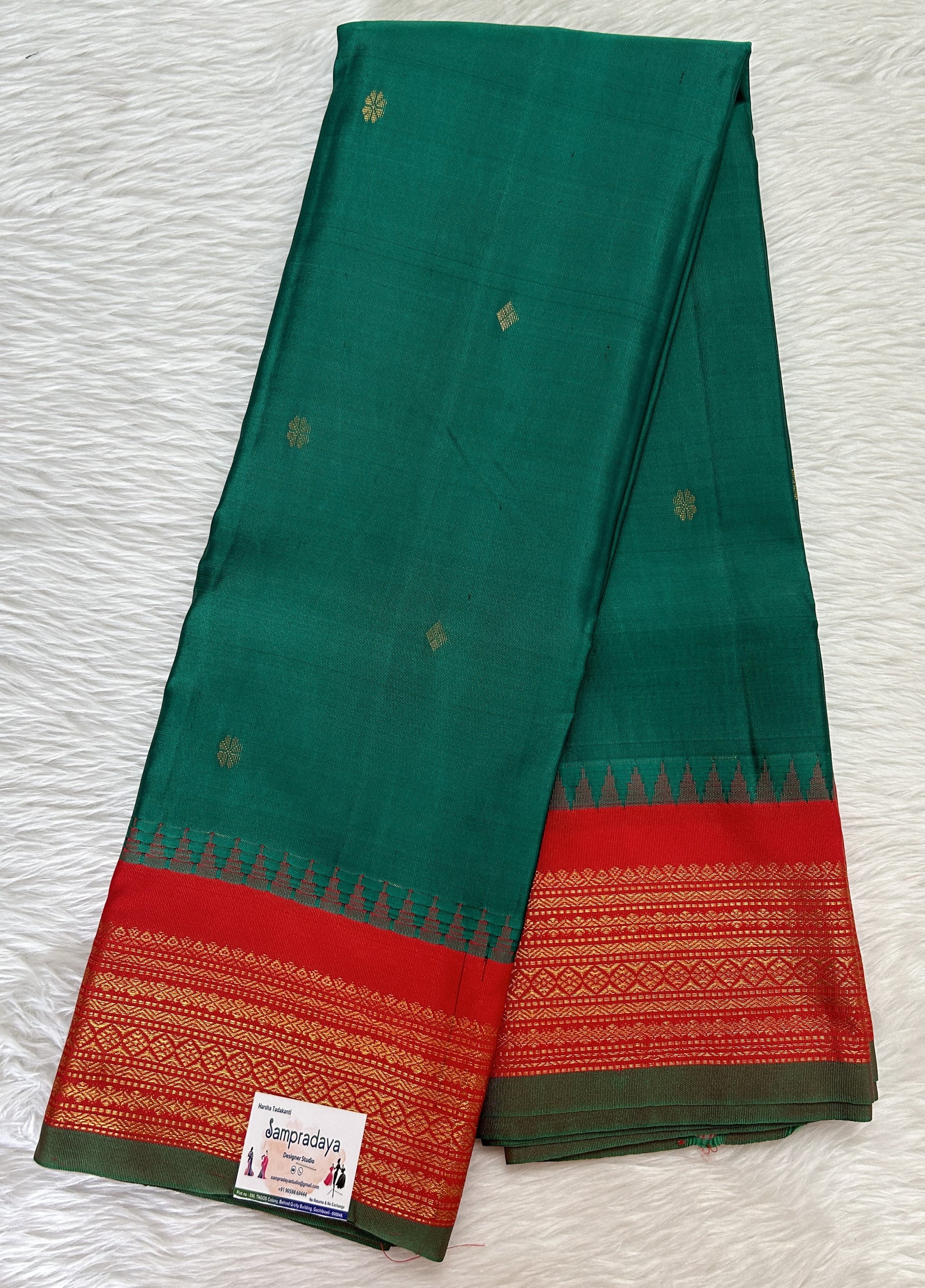 Gadwal Pattu Saree Dark Green colored saree complemented with a Red Kanchi Border - Sampradaya Designer Studio