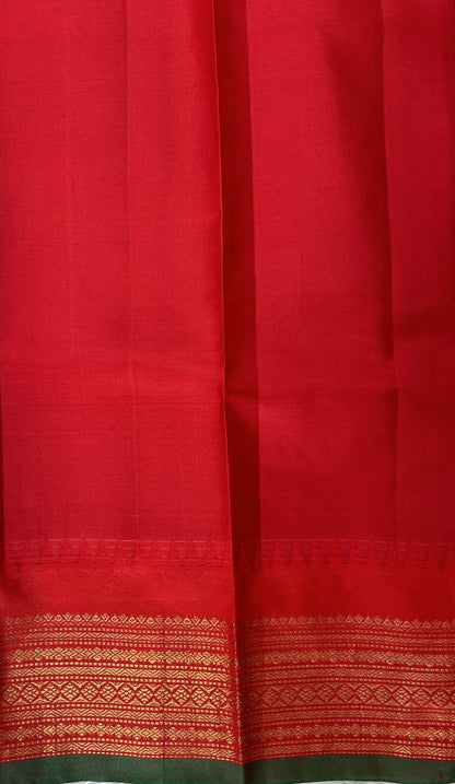Gadwal Pattu Saree Dark Green colored saree complemented with a Red Kanchi Border - Sampradaya Designer Studio