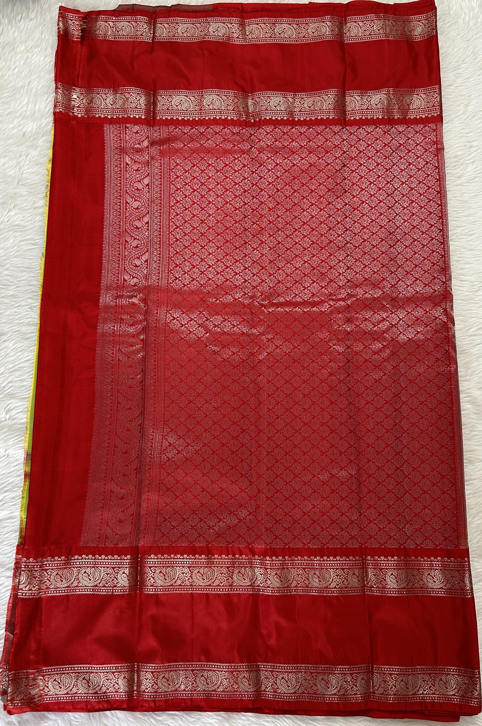 Gadwal Pattu Saree Avocado Green colored saree complemented with a Red Kanchi Gap Border - Sampradaya Designer Studio