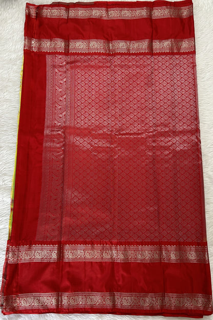 Gadwal Pattu Saree Avocado Green colored saree complemented with a Red Kanchi Gap Border - Sampradaya Designer Studio