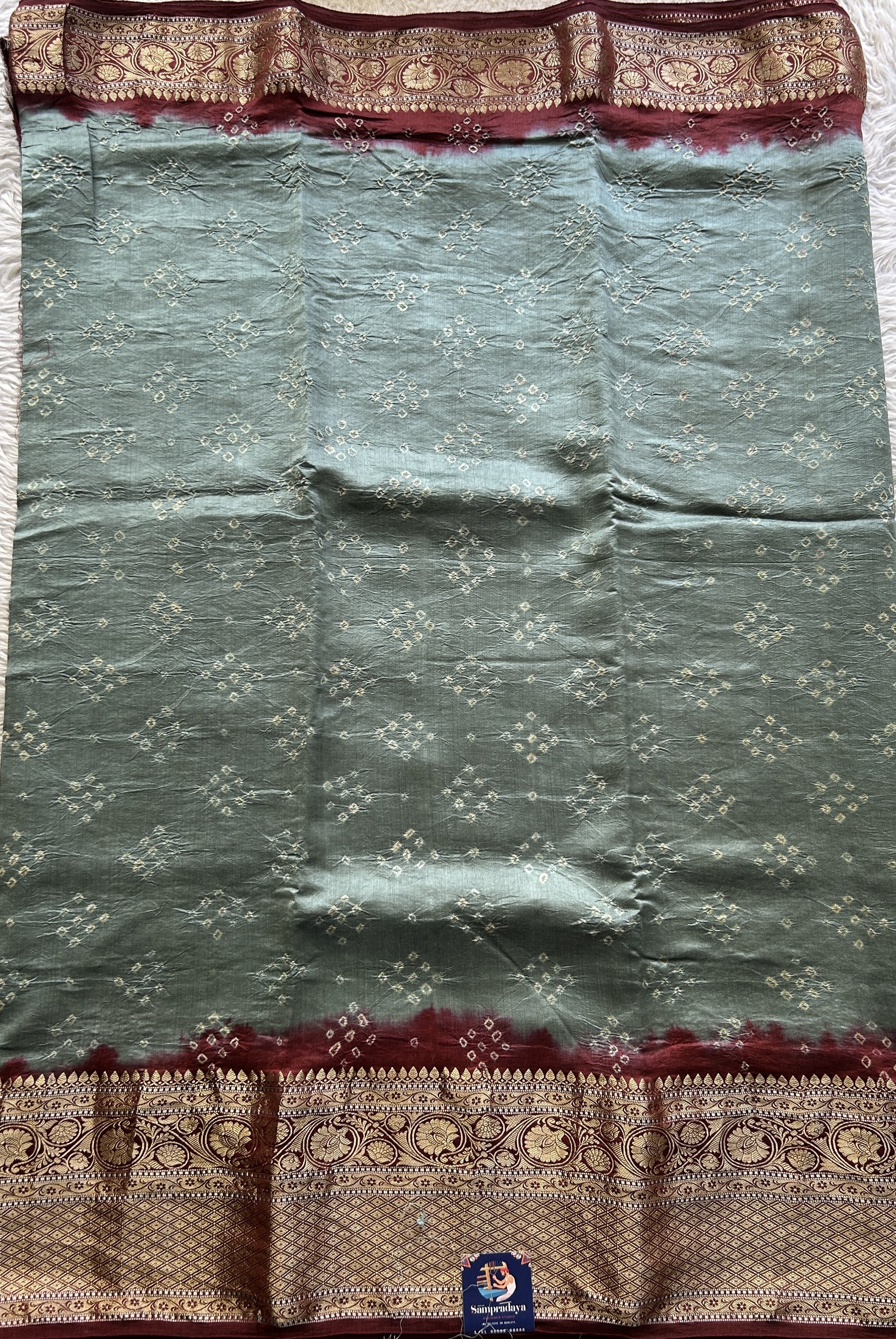 Bandhani Saree Gray Colored Elegantly Paired with a Rust Color Zari Border. - Sampradaya Designer Studio