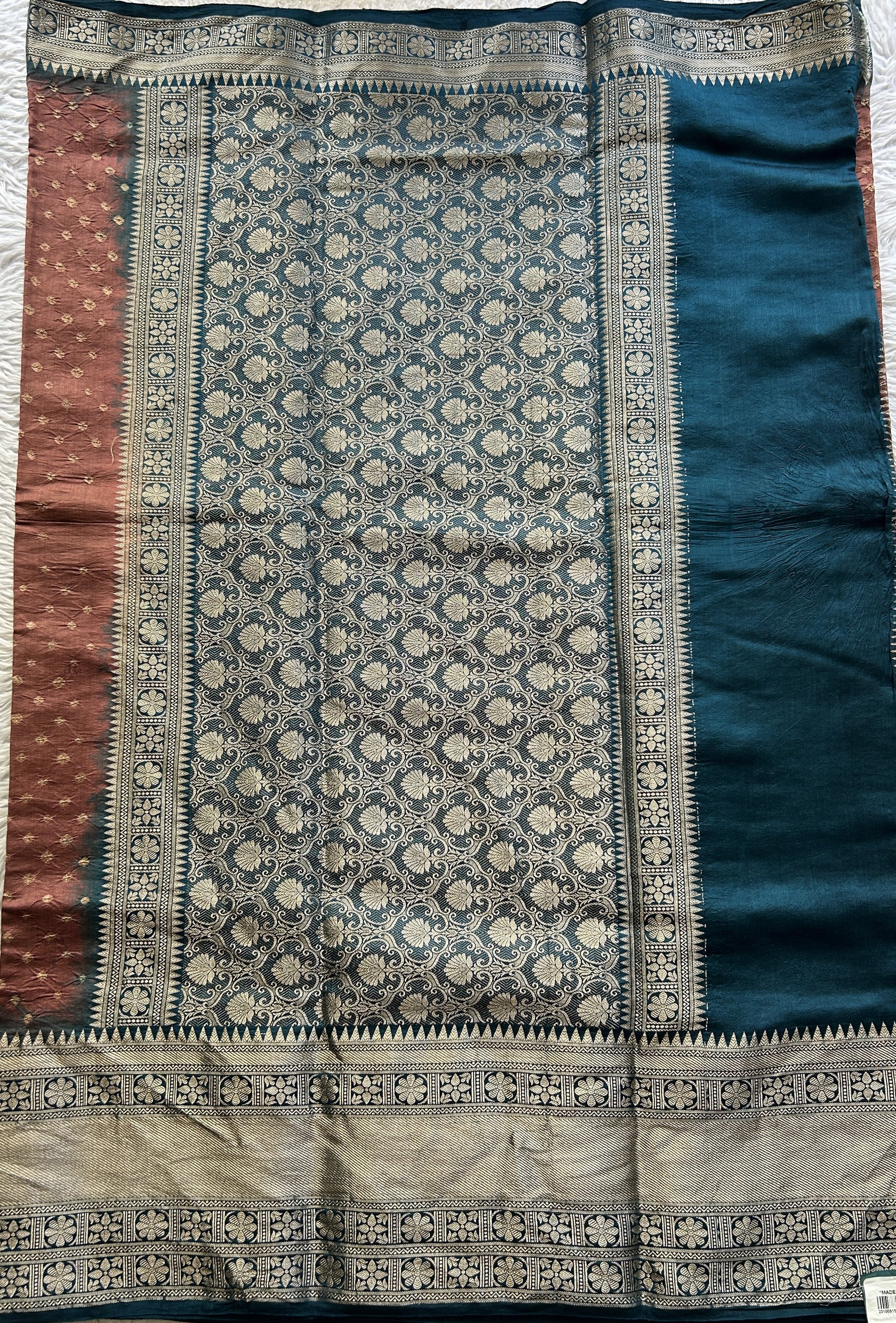 Bandhani Saree Rust Colored Elegantly Paired with a Teal Blue Color Zari Border. - Sampradaya Designer Studio